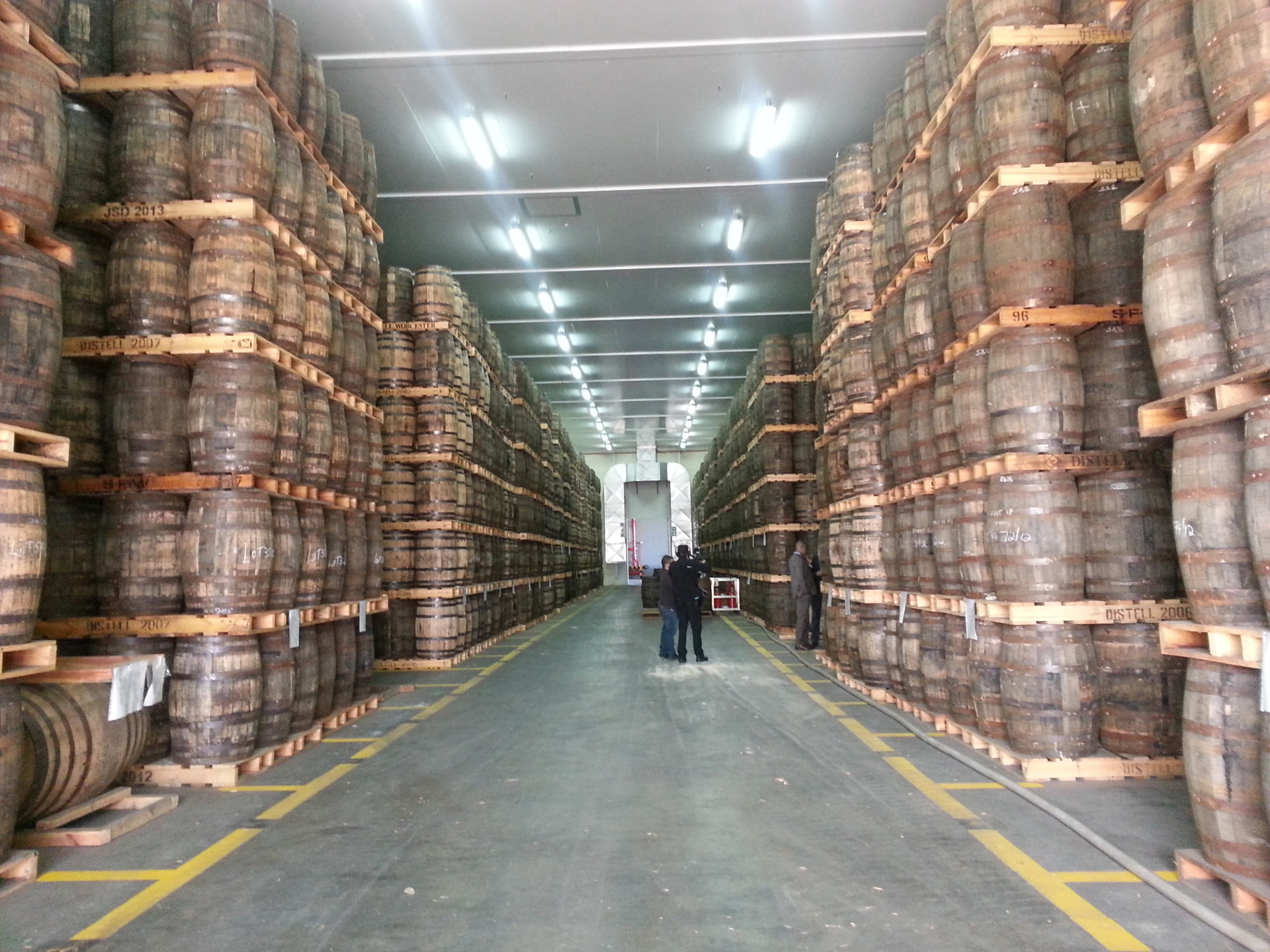 Warehouse of maturing barrels stacked to the ceiling in a South African distillery