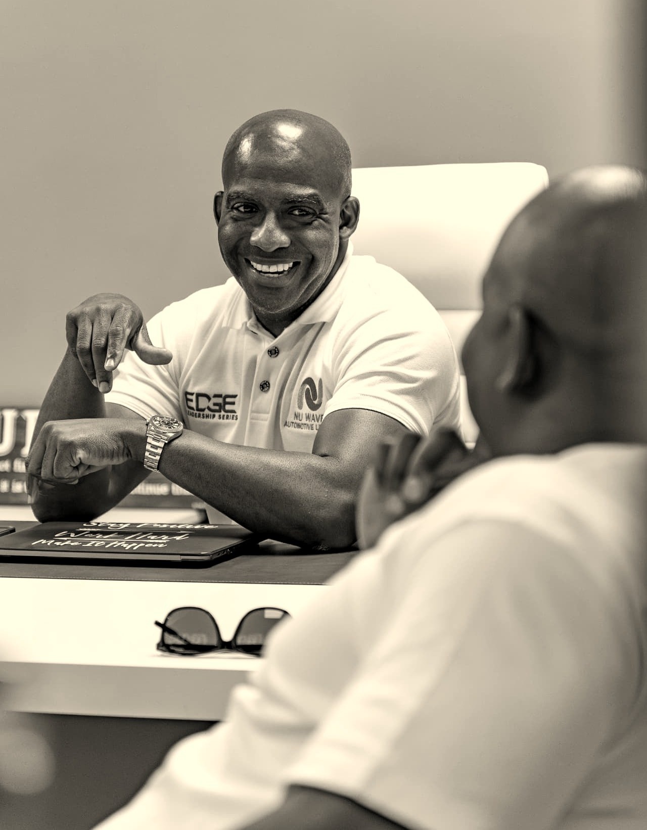 A South African founder speaking to peers on a factory floor